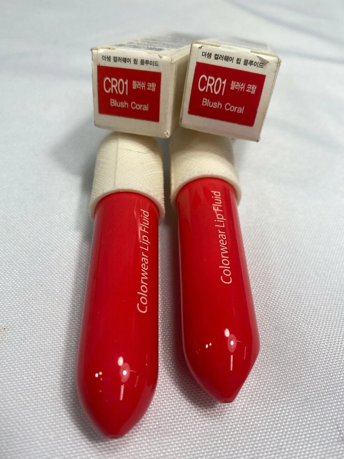 (2)  the SAEM Colorwear Lip Fluid CR01 Blush Coral