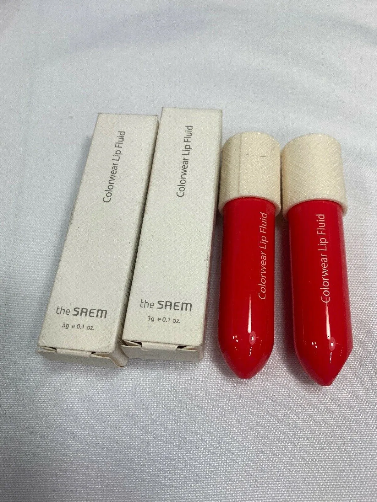 (2)  the SAEM Colorwear Lip Fluid CR01 Blush Coral